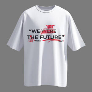 White oversized t-shirt with black text 'We WERE the Future' struck in red, and 'ARE' above it – bold unisex graphic streetwear.