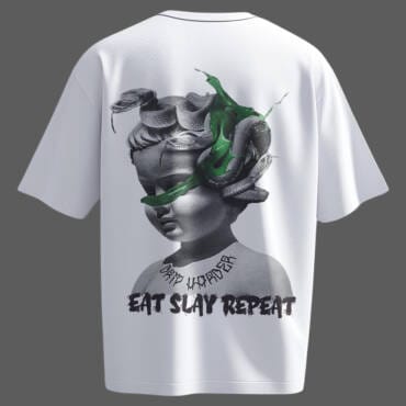 White oversized t-shirt featuring a Medusa-inspired statue graphic with snakes, grunge typography, and bold neon green streaks. A perfect statement piece for modern streetwear lovers.