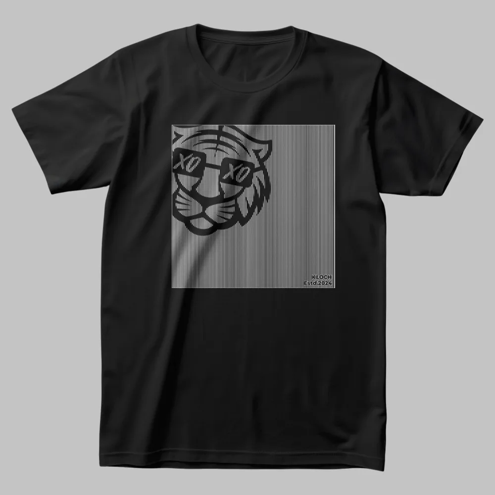 A black oversized t-shirt featuring a glitch-style tiger face with XO eyes, printed on a fine-line gradient background. A Kloch Exclusive streetwear essential.