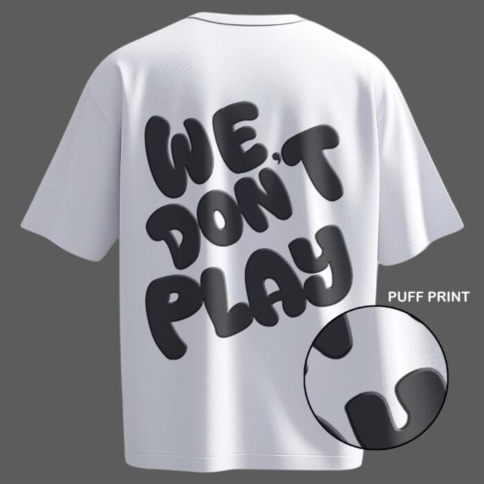 Oversized white streetwear t-shirt featuring 3D puff print "We Don’t Play" text – a bold and stylish must-have for urban fashion lovers.