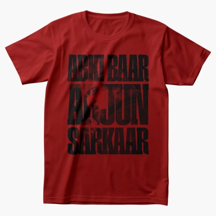 Red T-shirt with bold black text "Ab Ki Baar Arjun Sarkaar" featuring Nani's character from HIT 3 subtly visible behind the print.