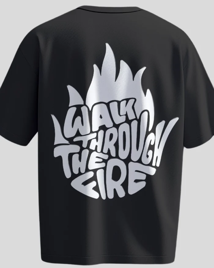 Back view of black oversized unisex t-shirt with bold white flame-shaped graphic text “Walk Through The Fire” – motivational streetwear by Kloch.
