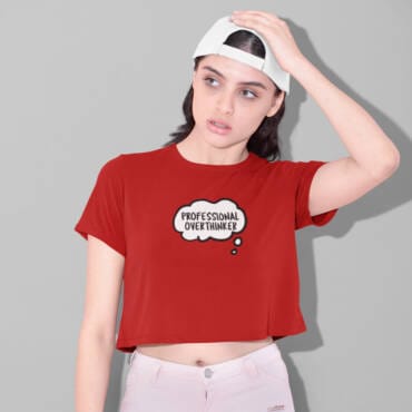 Woman in red “Professional Overthinker” crop top with thought bubble print – cotton quirky tee from Kloch