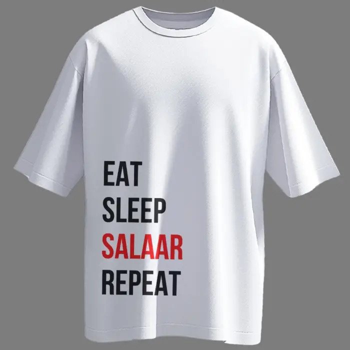 Black oversized t-shirt with bold white typography reading “EAT, SLEEP, SALAAR, REPEAT” – inspired by viral fanwear for Prabhas fans