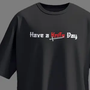 Black oversized unisex t-shirt with white and red “Have a Knife Day” print featuring a knife graphic – Kloch streetwear