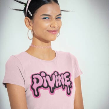 Woman wearing pastel pink “Divine” typography crop top with drip design – Kloch cotton Y2K-style crop tee