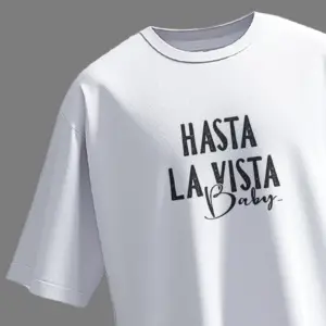 Front view of white oversized unisex t-shirt with "Hasta La Vista Baby" text printed in bold black typography