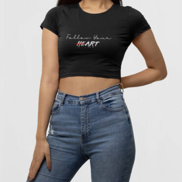 Woman wearing a black “Follow Your Heart” crop top from Kloch – cotton slim fit tee for women