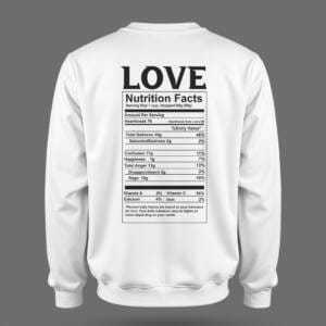 White sweatshirt with a black parody “Love Nutrition Facts” label on the back, listing emotions like heartbreak, sadness, and happiness.