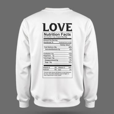 White sweatshirt with a black parody “Love Nutrition Facts” label on the back, listing emotions like heartbreak, sadness, and happiness.