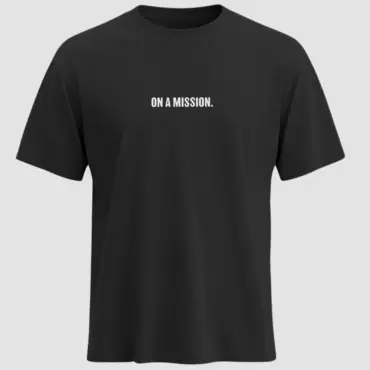 Black t-shirt with bold white uppercase text “ON A MISSION.” printed on the chest
