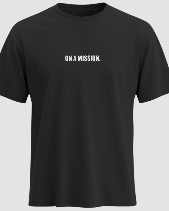 Black t-shirt with bold white uppercase text “ON A MISSION.” printed on the chest