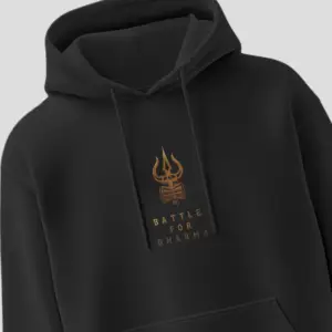 Black unisex hoodie with golden trishul and “Battle for Dharma” text – spiritual streetwear by Kloch
