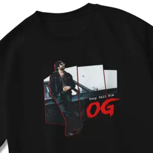 OG “They Call Him OG” Oversized Black T-Shirt featuring Pawan Kalyan leaning against a car with red frame accents.